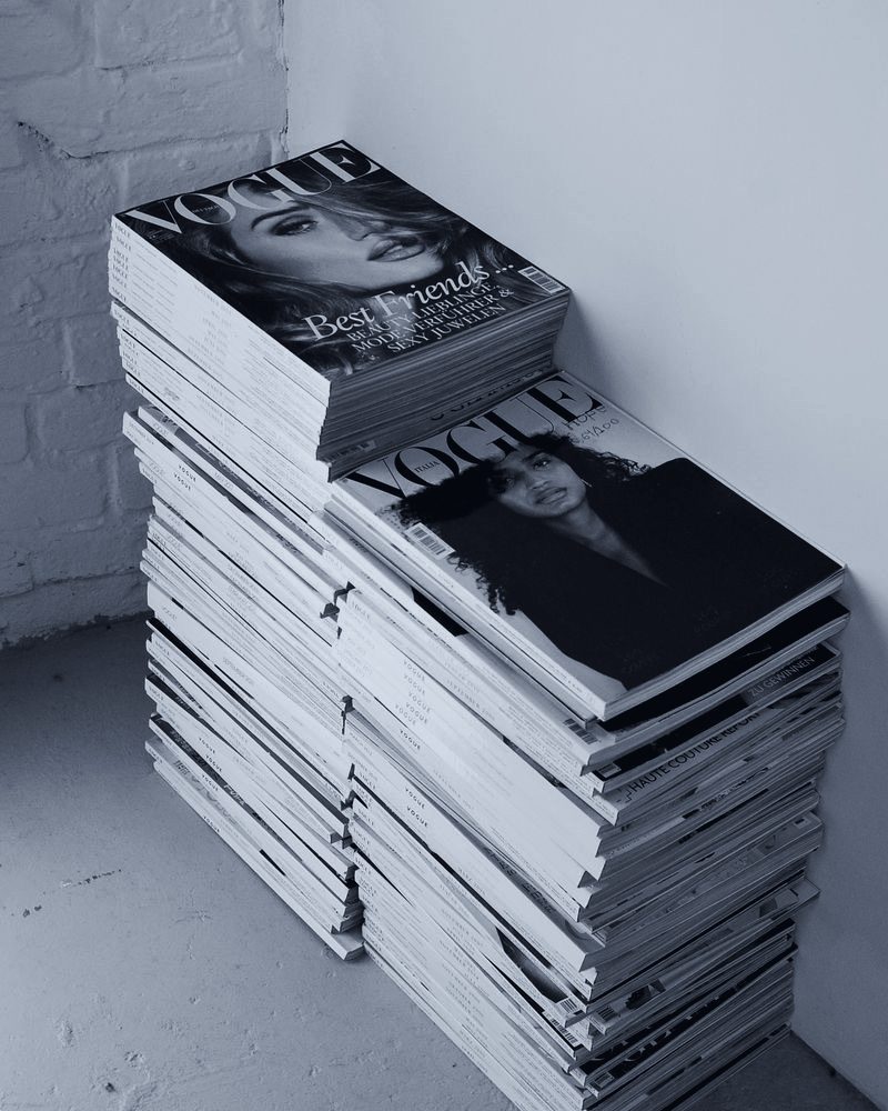 Stacked print editions representing earned editorial coverage