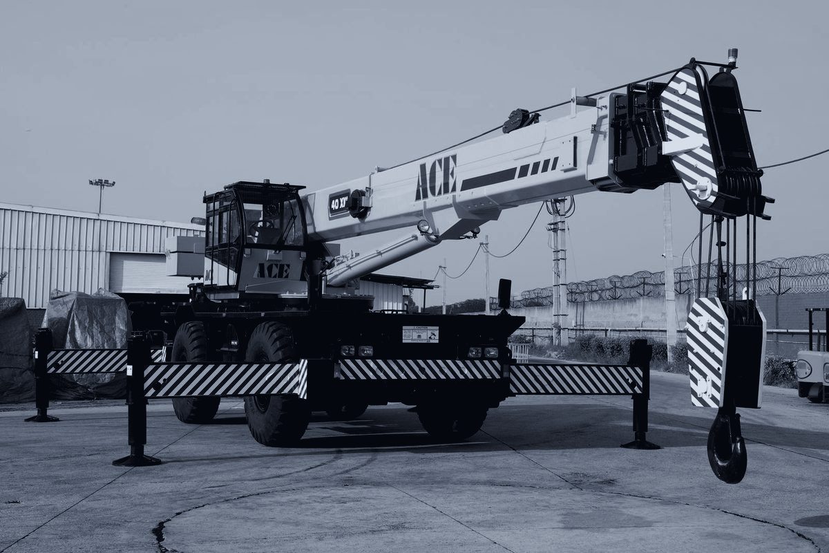 A rough-terrain crane rigged for an industrial lift